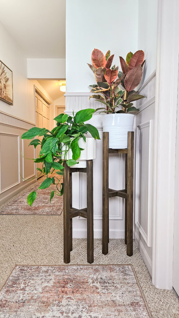 DIY Plant Stands in hallway with pole wrap trim and box detail